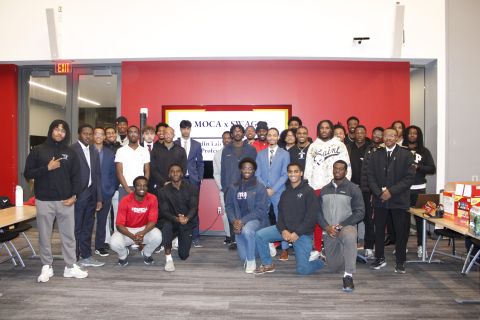 Ayotunde Ejiko with a large Cornell Men of Color in Athletics community group